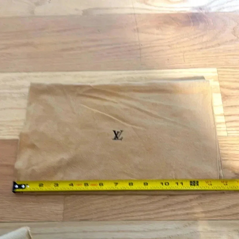 Authentic Louis Vuitton, dusk cover, measures 9”H x 14” W